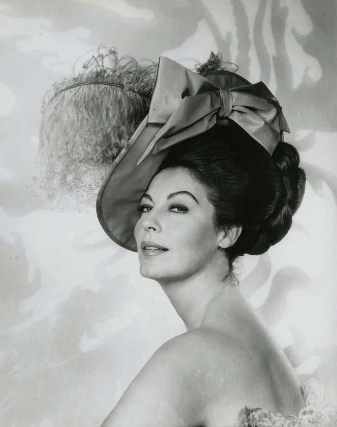 Ava Gardner in a plumed hat with a large satin bow